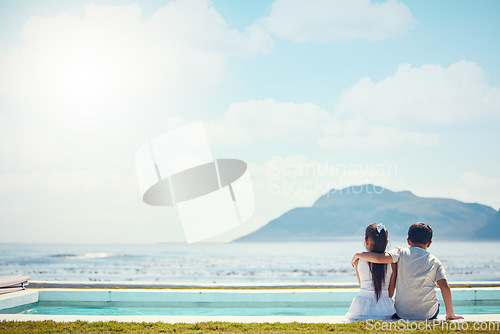 Image of Siblings, hug and love with back by beach, sea and horizon in mock up space for friends, holiday or outdoor. Kids, girl and boy with support by mountain, ocean or waves for mockup in summer vacation