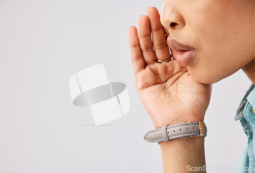 Image of Woman, secret and hand over mouth on mockup in studio against a gray background to whisper gossip or a rumor. Communication, news and a female closeup talking with secrecy to keep her voice silent