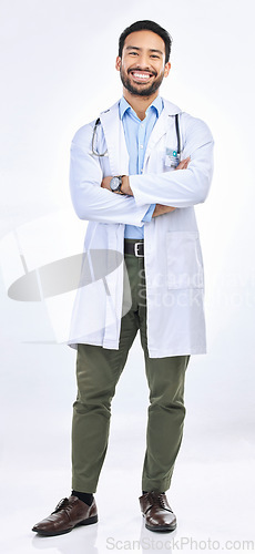 Image of Happy man, portrait and doctor in a studio with confidence ready for work. Isolated, white background and arms crossed of a proud surgeon with happiness from healthcare, wellness and hospital job