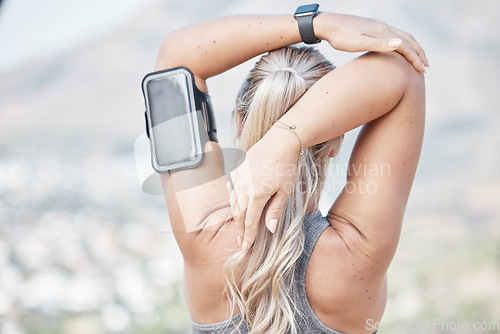 Image of Fitness, woman and back stretching arms for exercise, running or start workout in nature. Rear view of fit female runner in warm up arm stretch for training preparation or healthy wellness outdoors