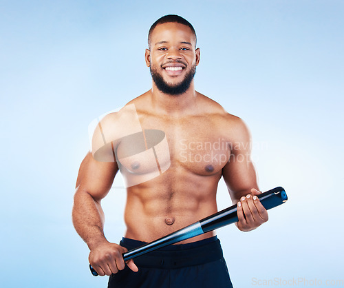 Image of Black man, portrait and sports body with a baseball bat in studio for health, wellness and fitness. Face of healthy male aesthetic model with sport gear, strong muscle and smile on a blue background