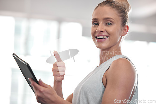 Image of Tablet, fitness woman portrait and thumbs up of a happy female in a gym with training exercise app. Yes, agreement and motivation hand gesture of a personal trainer with a smile while checking data