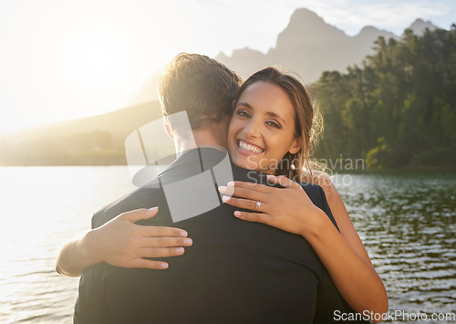 Image of Wedding, lake and portrait of happy couple hugging in nature and water with passion, smile and romance. Marriage, bride and groom hug to celebrate romantic relationship, loving man and woman together