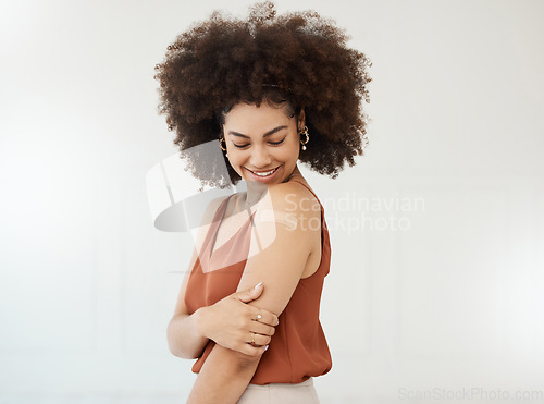 Image of Covid plaster, arm and smile of black woman in studio for injection with medical insurance. African female happy on a white background with healthcare vaccine, safety compliance and mockup space