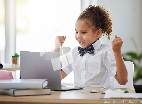 Image of Laptop, winning and business child in office with achievement, victory and online bonus at home. Success, education and young girl on computer celebrate, happy and excited for homeschool results