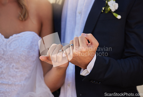 Image of Wedding, rings and closeup of a couple with a pinky promise for love, loyalty and marriage. Romance, hands and married man and woman with jewellery for their union and bond at a romantic event.