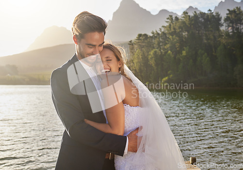 Image of Happy, hug and couple at a lake wedding with love at a ceremony, celebration and marriage. Smile, affection and a man and woman hugging after romantic relationship commitment in nature together