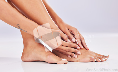 Image of Closeup, skincare and legs with beauty, dermatology and wellness against a studio background. Feet, female and woman with hair removal, salon treatment and luxury with grooming, smooth and soft skin