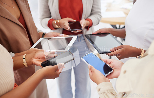 Image of Collaboration, technology and networking with a team of business people in a huddle to share information. Group, data and communication with colleagues standing in a circle in the office at work