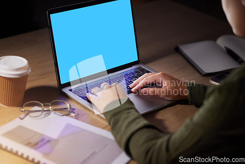 Image of Hands, woman and laptop with mockup, space and screen in office at night for advertising, marketing and typing. Blank, display and female corporate employee online for branding, design and proposal