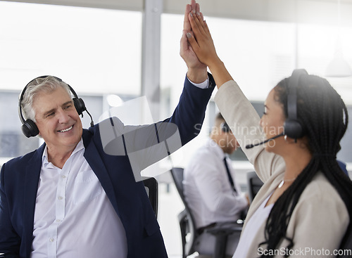 Image of Man, woman and high five in call center with diversity in team building, happiness and solidarity. Business people, crm teamwork and group with support, celebration and excited in telemarketing job