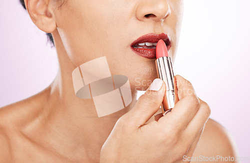 Image of Lipstick application, woman and mouth on studio background for beauty, fashion and aesthetics. Closeup female model, red lips and makeup for glamour cosmetics, elegant skincare and color cosmetology