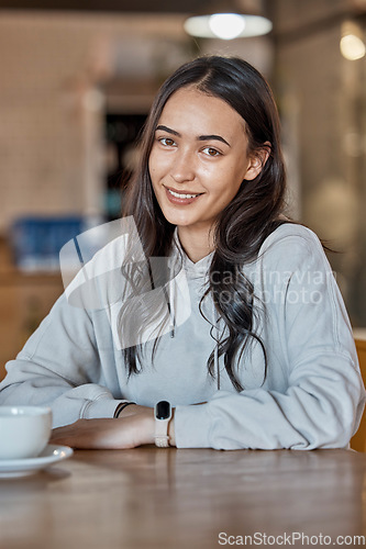 Image of Cafe, relax and portrait of woman with coffee in restaurant with hot beverage, cappuccino and latte drink. Happy, smile and face of real girl sitting by table for relaxation and happiness on weekend