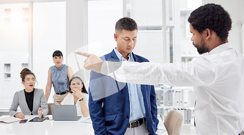 Image of Fired, fight and angry boss is frustrated with employee and upset manager pointing out embarrassing colleague. Gesture, corporate and black man shouting at worker in an office or boardroom