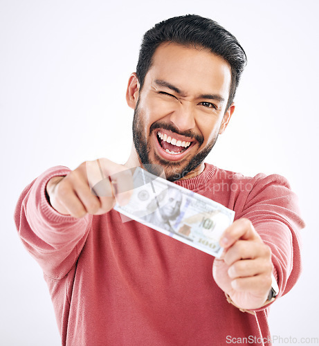 Image of Money, cash and portrait of man wink on white background for investment, financial savings and payment. Finance profit, winner and excited male for winning, bonus and stock market success in studio