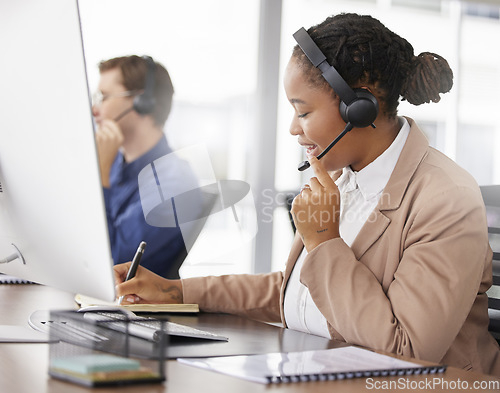 Image of Black woman, call center and writing notes, smile in office and working on customer service in workplace. Telemarketing, notebook and happy person, female sales agent or consultant talking online.