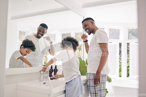 Image of Brushing teeth, father smile and healthy morning routine in a bathroom sink with a dad and child. Hygiene, kid and dada together in a house with toothbrush and youth doing self care for dental