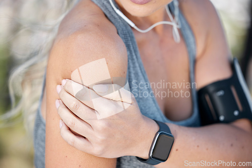 Image of Fitness, woman and hands with shoulder pain, injury or accident from workout, exercise or training outdoors. Closeup hand of sporty female holding painful arm, joint or muscle in ache from exercising