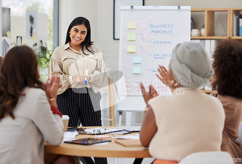 Image of Business presentation, woman speaker and applause from women employee group from analysis data. Whiteboard, happy worker smile of cheering staff from collaboration and teamwork of working team