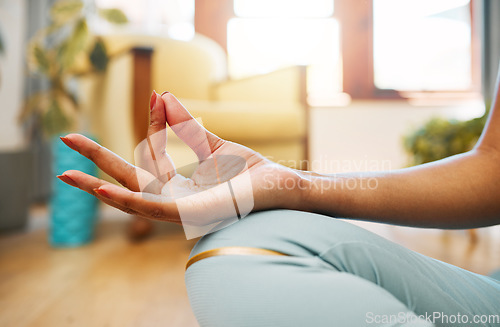 Image of Hand, fitness or woman in yoga lotus pose for meditation, awareness or healthy wellness lifestyle. Chakra, calm or active zen girl in sitting exercise, workout or training in house exercising studio