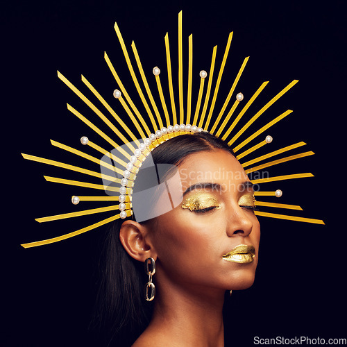 Image of Crown, gold makeup and an elegant queen isolated on a black background in a studio. Dreaming. art and an Indian goddess with cosmetics, accessories and jewelry for royalty on a dark backdrop