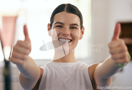 Image of Happy woman, thumbs up portrait and gym fitness of a young female with happiness from exercise. Workout, sport and winner yes hand gesture in a health club feeling healthy from sports training