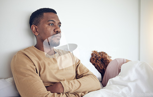 Image of Couple fight, angry black man and bedroom with a woman together feeling frustrated in a bed. Home, conflict and relationship problem of a marriage fail, divorce issue and break up stress in morning