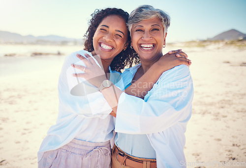 Image of Portrait, family and mother with adult daughter hug, happy and bond at beach together, smile and relax. Love, parent and girl embrace, travel and excited for ocean trip, holiday and freedom in Miami