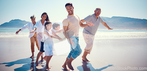 Image of Beach, family playing and running together on holiday, generations walking on ocean sand. Fun, vacation and happy men, women and kids bonding, quality time and summer adventure in nature in Mexico.