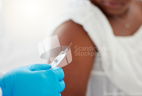 Image of Hand, covid vaccination and a patient with her doctor in the hospital for an injection of medicine or antibiotics. Healthcare, medical and consulting with a healthcare professional holding a syringe