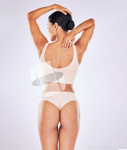 Image of Back skincare, woman body and butt in a studio with wellness, underwear and fitness. Cosmetics, liposuction and cellulite beauty treatment of a female with skin glow with isolated white background