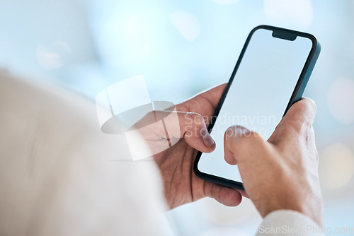 Image of Businessman, hands and phone with mockup screen for social media, advertising or marketing at office. Hand of man typing on mobile smartphone app display for communication or networking on copy space