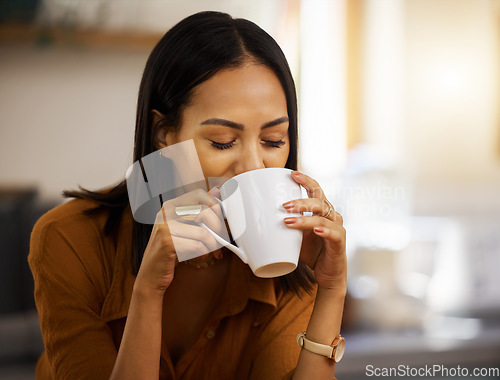 Image of Happy, coffee and woman at home in a kitchen with a hot drink feeling relax and calm in the morning. Happiness, zen and young female drinking in a house holding a mug in a household with mockup