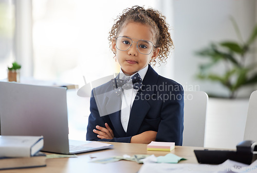 Image of Girl child, arms crossed and portrait in office with annoyed face for game, playing and learning. Kid, boss and games in workplace with serious expression, glasses and focus for goals at business