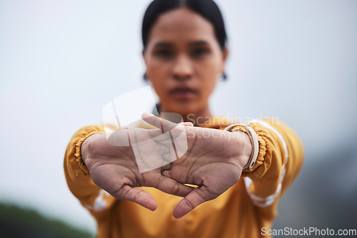 Image of Woman, hands and runner, fitness with stretching and outdoor running in nature. Exercise, cardio and palm, serious female and warm up for run, training for race or marathon and active lifestyle