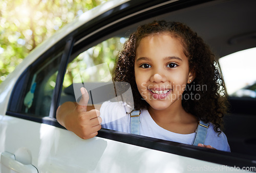 Image of Portrait, road trip and girl with a thumbs up in a car for travel, content with transportation and ride. Happy, review and a child with a hand gesture for transport satisfaction, approval and like