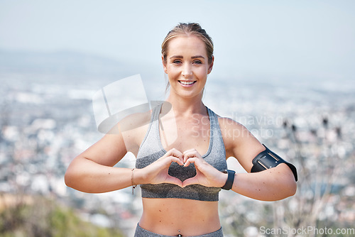 Image of Fitness, woman and portrait with heart hands for workout, exercise or running and healthcare in nature. Happy or fit female smiling showing loving hand emoji, symbol or shape for self love or care