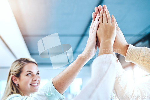 Image of Business people, high five and team collaboration for agreement, community or trust in unity at office. Group touching hands together in teamwork for corporate goals, celebration or support at work