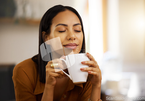 Image of Happy smile, coffee and woman at home in a kitchen with a hot drink feeling relax and calm in the morning. Happiness, zen and young female in a house holding tea and mug in a household with mockup