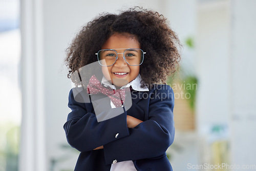 Image of Portrait, business person and black child arms crossed, confident and happiness in office. Face, African American female child and kid with gesture for leadership, employment and smile in workplace