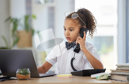 Image of Children, telephone and a girl having fun in an office as a fantasy businesswoman at work on a laptop. Kids, phone call and a female child working at a desk while using her imagination to pretend