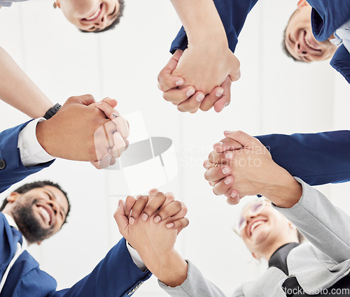 Image of Team building, support or happy business people holding hands for collaboration, motivation or community. Vision, low angle or excited group of workers with smile, mission goals or target together
