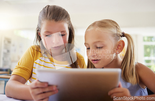 Image of Tablet, friends and girls in classroom for learning, education and online knowledge. Kindergarten, technology and kids or students with touchscreen in preschool for studying and playing together.