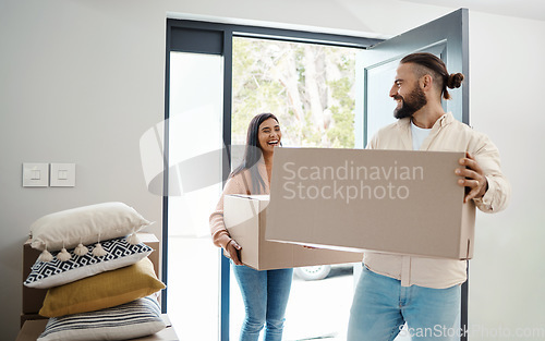 Image of Couple moving, new house and box with happiness, man and woman, real estate property and home owner. People carrying boxes, laughing together and partnership, happy with mortgage and funny relocation