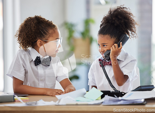 Image of Talking, telephone and kid boss in the office while working on a project together with teamwork. Collaboration, landline and girl children ceo in business people cosplay or costume in a workplace.