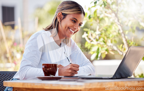 Image of Woman writing notes, student and laptop, learning with smile and study academic course, education and university. Female at outdoor cafe, freelancer and research for project, happy with productivity