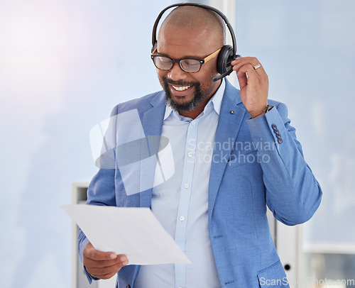 Image of Black man, call center and business consulting with script for telemarketing, sales or customer service at office. Happy African American male salesman with headphones and policy for communication