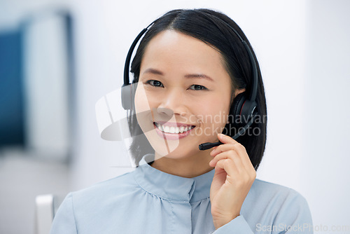 Image of Asian woman, call center and happy in portrait, communication and CRM, headset with mic in office. Contact us, customer service or telemarketing, female consultant with smile and help desk