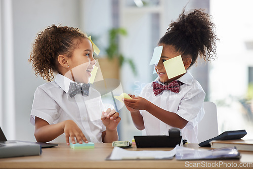 Image of Happy, playful and girls pretending to be business people, having fun with sticky notes and office equipment. Smile, funny and children playing dress up, play pretend and a game of work together