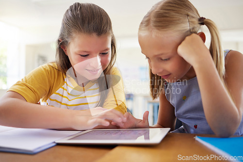 Image of Tablet, kindergarten and girls in classroom for elearning, education and online knowledge. Friends, technology and happiness of kids or students with touchscreen in preschool for studying together.